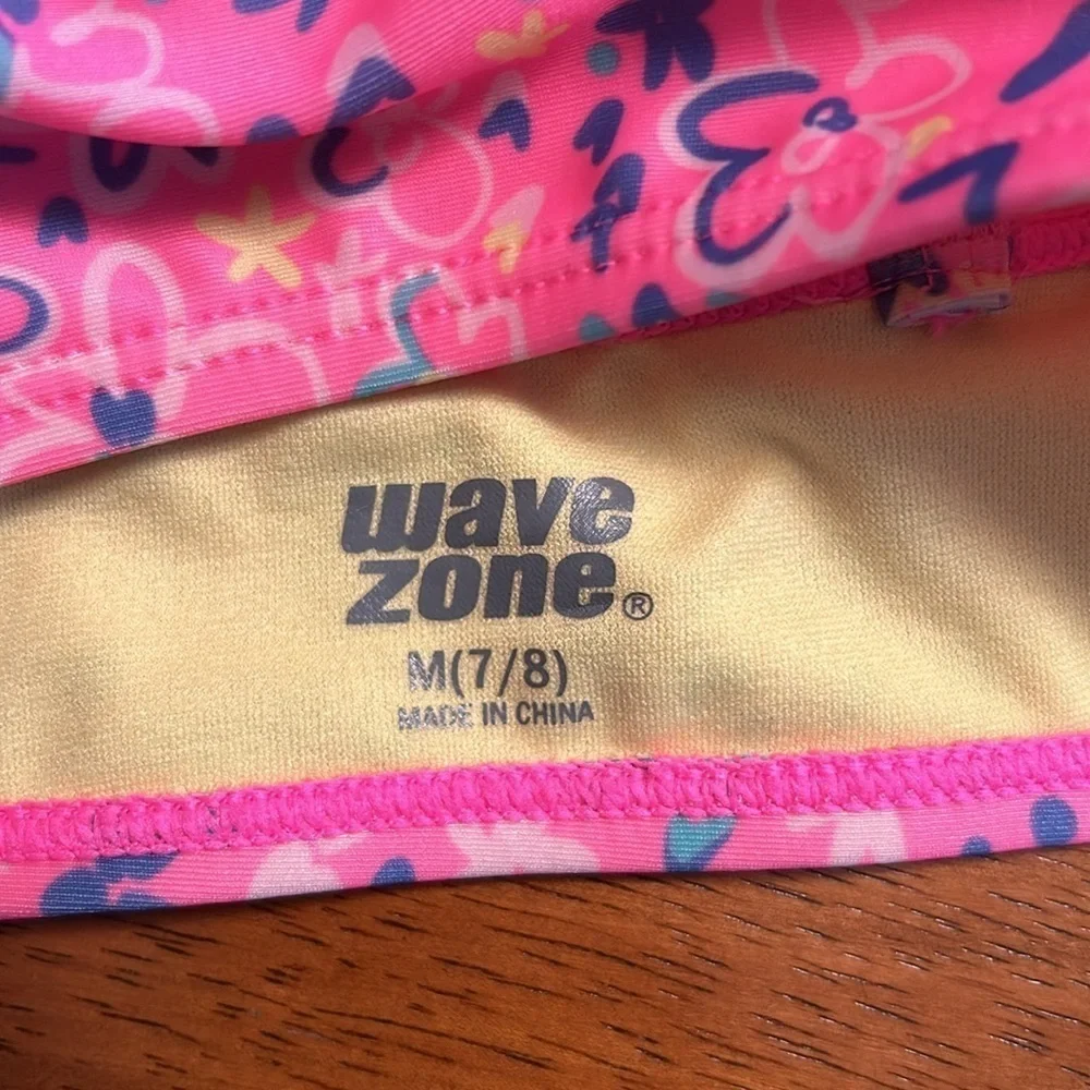 Girls set of swimsuits, pink set is a 7/8 and the one piece is a small.